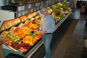 Photo of John Dyke in the original Turnip Truck in East Nashville 2001. Featuring fresh, local and organic produce and natural foods.